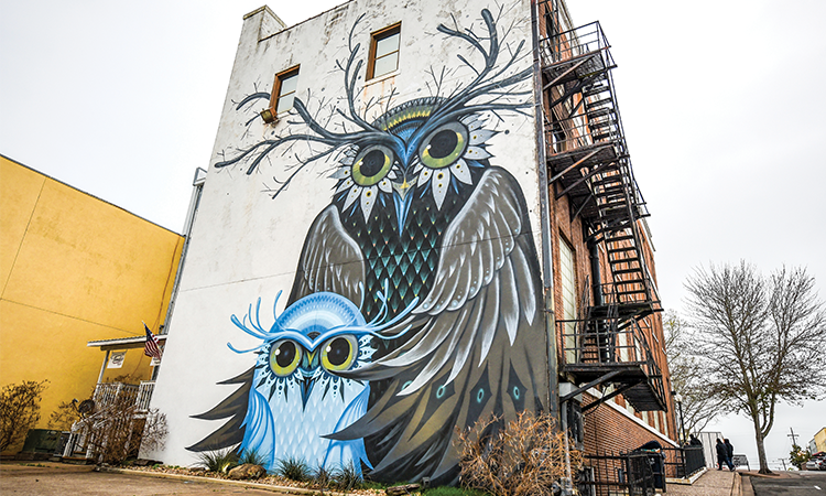 Brenham is home to many murals, including the 2017 ‘Owl Family,’ created by California muralist Jeff Soto.