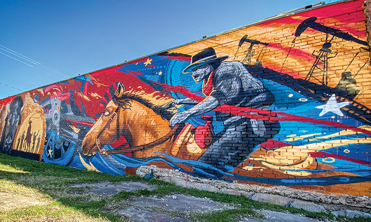 Visitors to Giddings can't miss the massive 15-by-90- foot 'Giddings Pride' mural painted in five days in 2020 by Los Angeles-based artist Matt ‘Kiptoe’ Dean. The mural is on the wall of Orsag's Furniture, 201 W. Austin St.