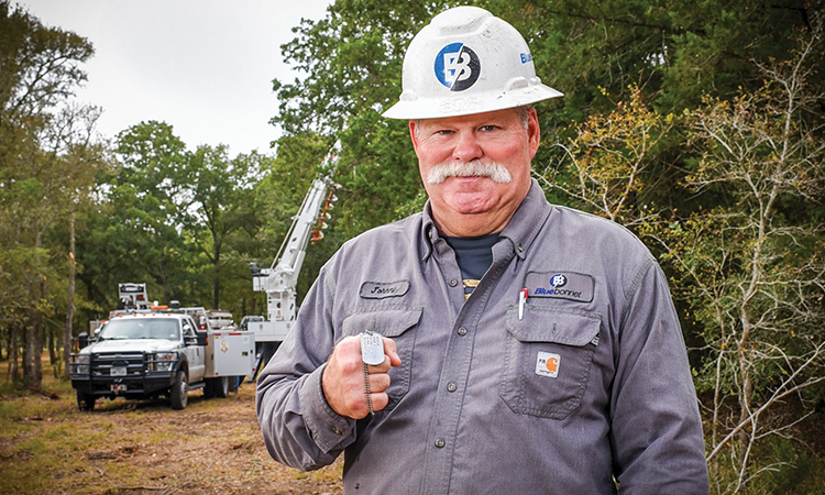  John ‘Johnny’ Horton shows his U.S. Army military I.D. dog tags. He served for four years in the U.S. Army and has been a Bluebonnet employee for almost two years.