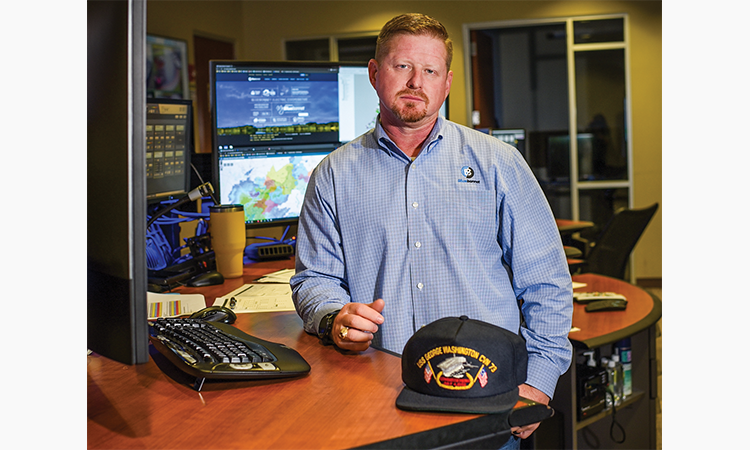 Matthew McGarr works in Bluebonnet’s Control Center. He worked with complex technology during his time in the Navy, too. His cap bears the insignia of the USS George Washington nuclear-powered aircraft carrier, on which he served.