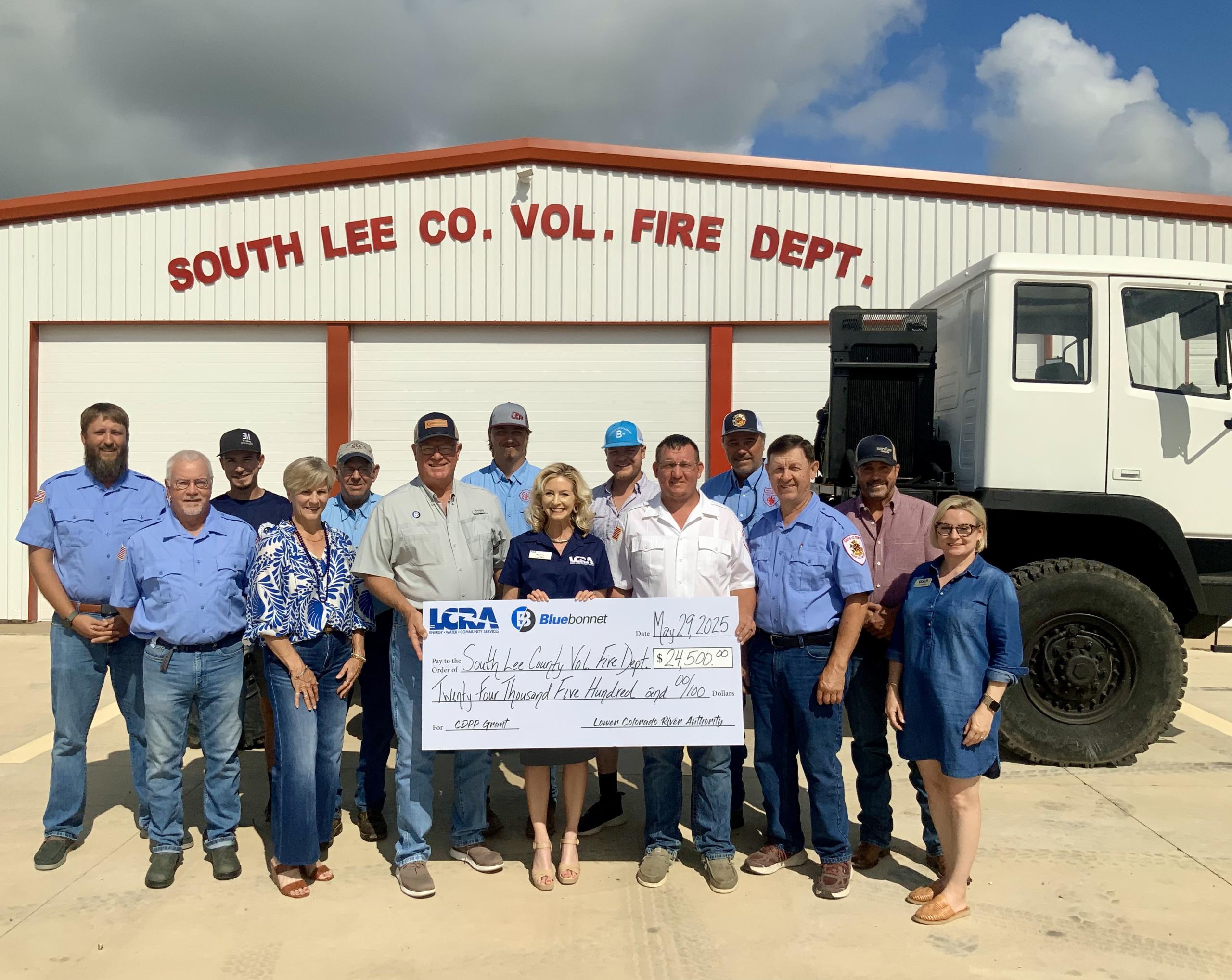 Bluebonnet Electric Cooperative and LCRA representatives present a $17,478 grant to the Round Top Library Association for an ADA-accessible deck and outdoor classroom. The grant is part of LCRA’s Community Development Partnership Program.
