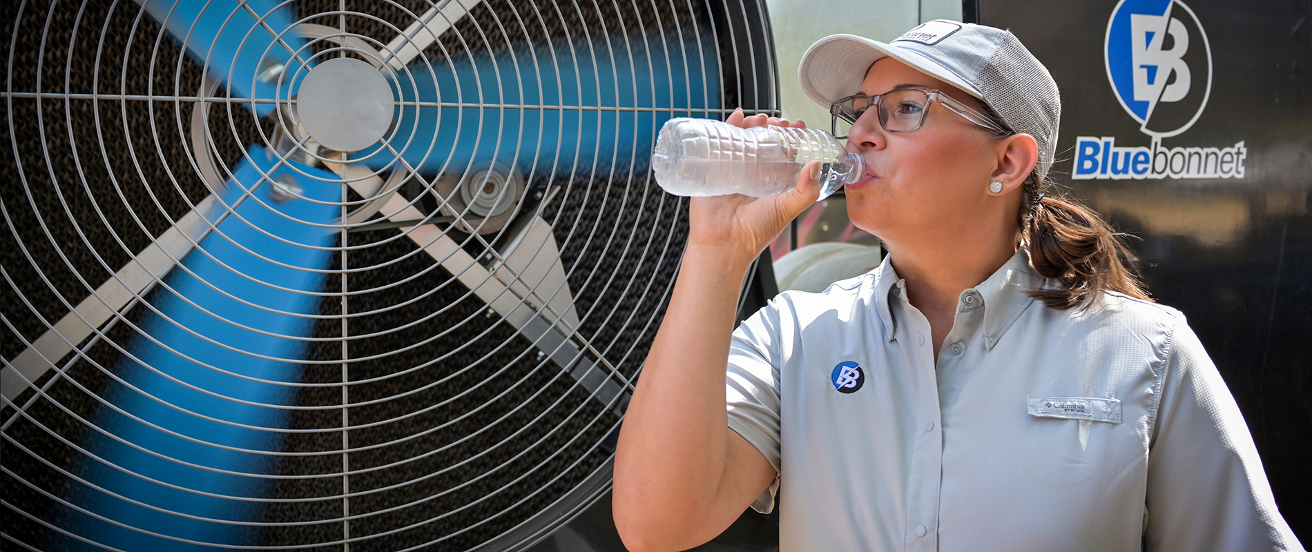 Bluebonnet employee drinking water