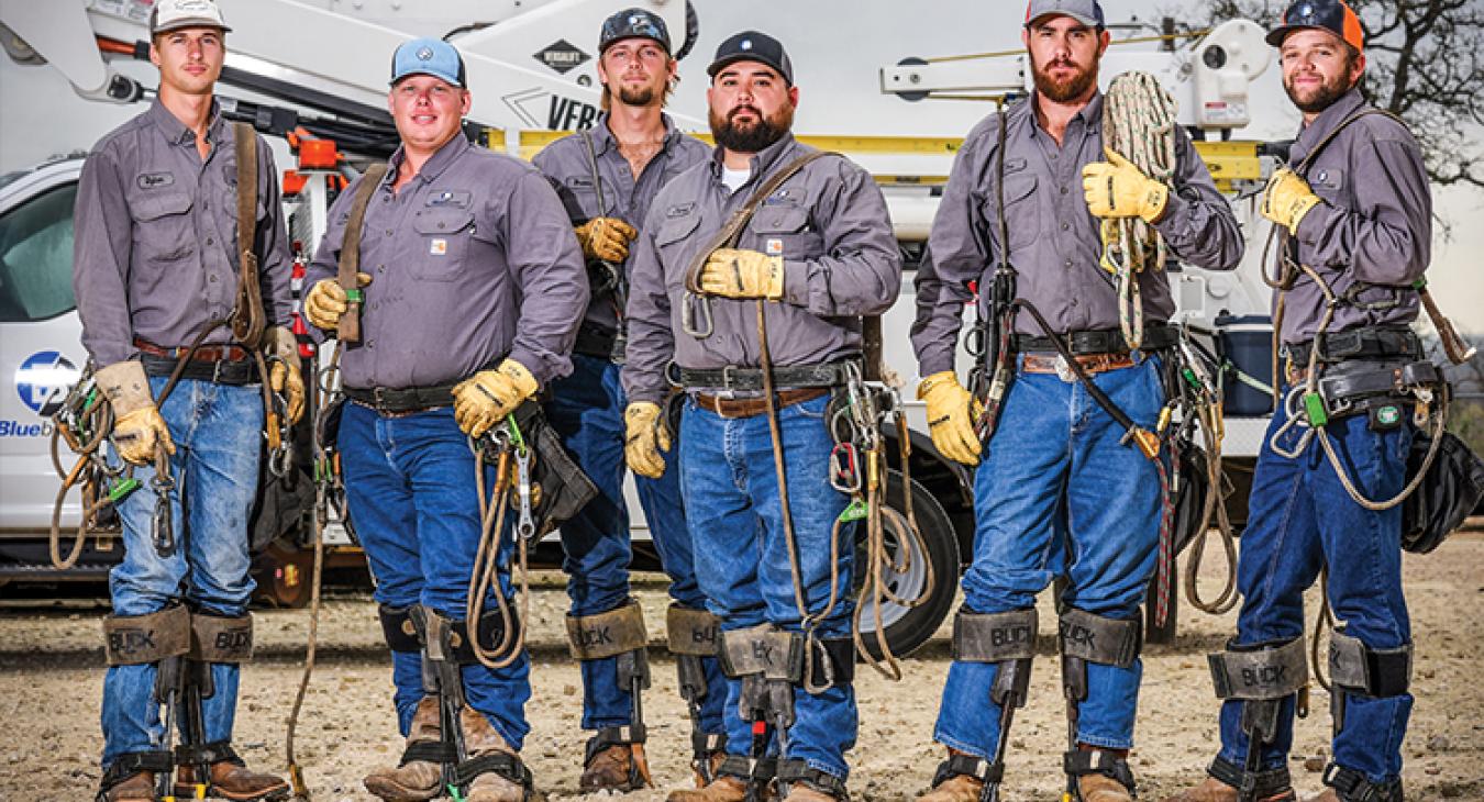 Six employees, who started as Bluebonnet’s first lineworker interns in 2018, have received U.S. Department of Labor certification. Today, they are journeymen line workers. They are, from left, Dylan Dussetschleger, Zackary Handrick, Brooks Kasper, James Flores, Tra Muston and Ty Duesterheft. (Photo by Sarah Beal)