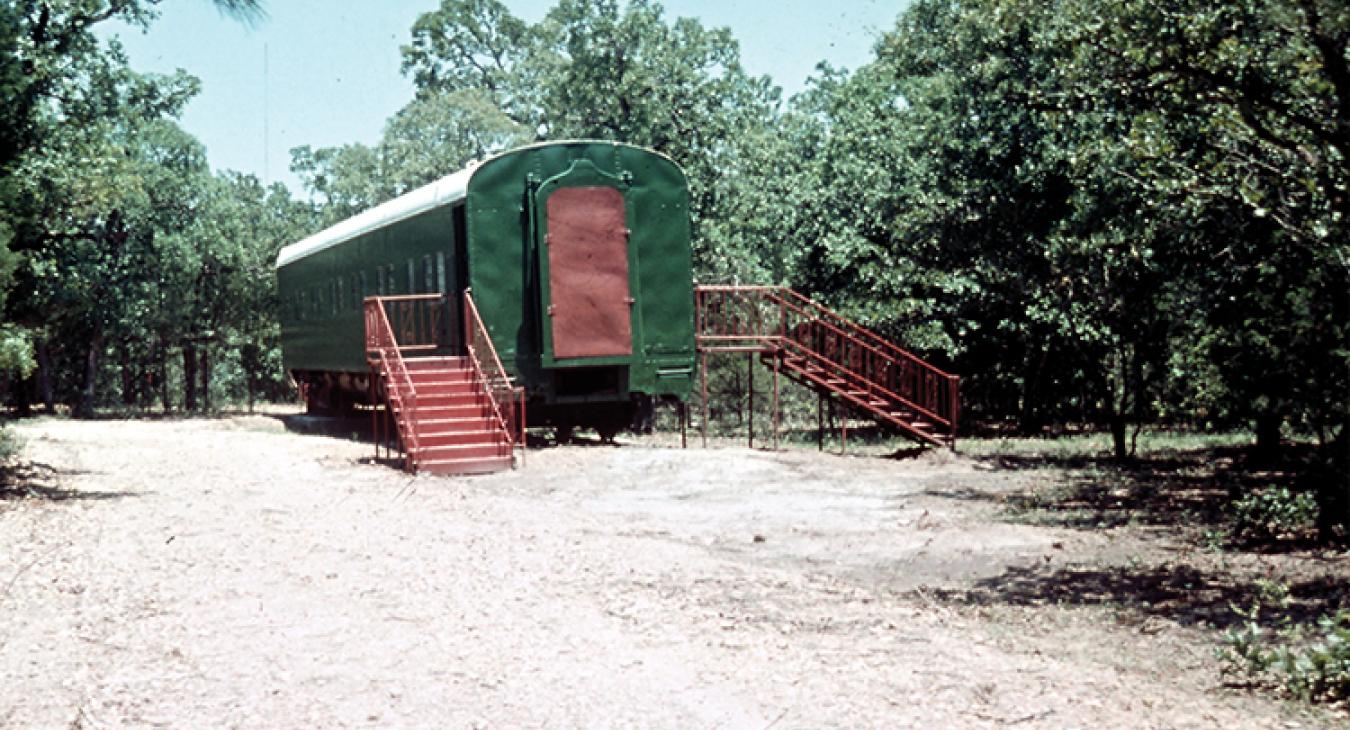 The first laboratory at Science Park was a hand-me-down Pullman rail car, left. In the mid-1970s, above, dignitaries study plans for the facilities.