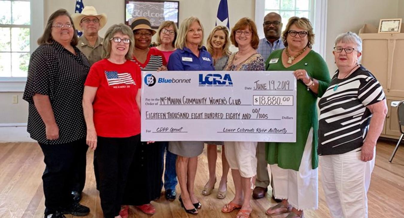 LCRA and Bluebonnet Electric Cooperative representatives present an $18,880 grant to the McMahan Community Women’s Club to upgrade and renovate the McMahan Community Center. The grant is part of LCRA’s Community Development Partnership Program.