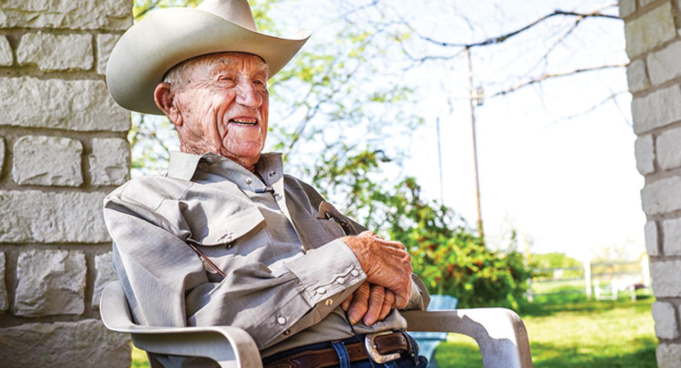 Arthur Goertz sits on the front porch of his neatly kept country home, looking out over the rolling pastureland and Post Oak savannahs of southwestern Bastrop County, his eyes squinting a bit under the brim of his Resistol.