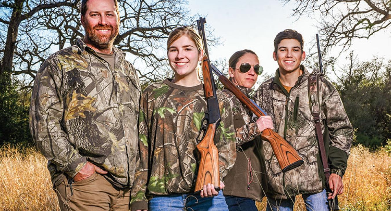 The Mobergs — from left, Victor, daughter Dakota, mom Shana and son Mason — have made it a family tradition to hunt deer on their 33 acres near Smithville. Dakota and Mason learned early by sitting quietly in the deer stand. (Photo by Sarah Beal) 