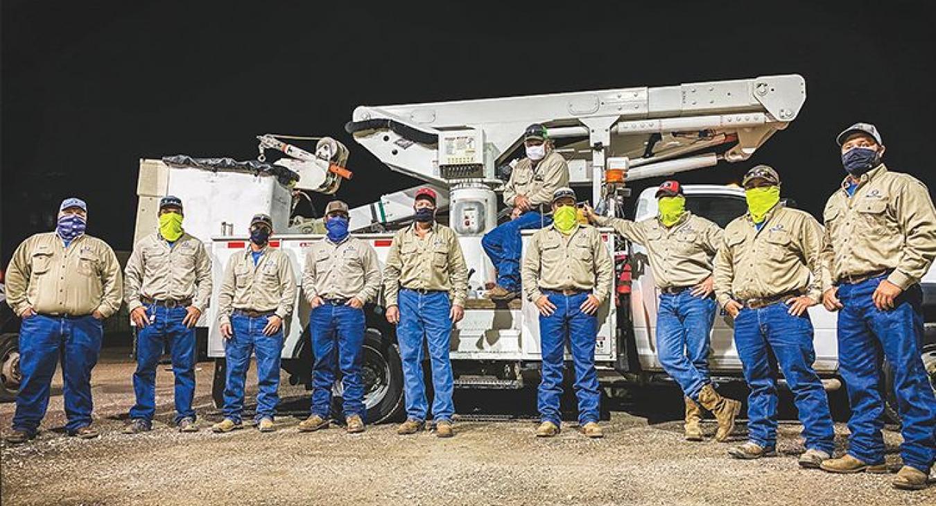 Bluebonnet crews traveled to Deep East Texas Electric Cooperative near the Louisiana border to help restore power to about 25,000 of its members after being hit by Hurricane Laura in late August. Above, from left, just before heading to East Texas, are Daniel Fritsche, Troy Moore, Eric Cobb, Chris Rivera, Michael Guajardo, John Horton, Nick Baker, Heath Walden, Joshua Gonzales and Derek Morgan. Below, from left: Bluebonnet crews use two bucket trucks and a digger truck to make repairs; Troy Moore, left, and