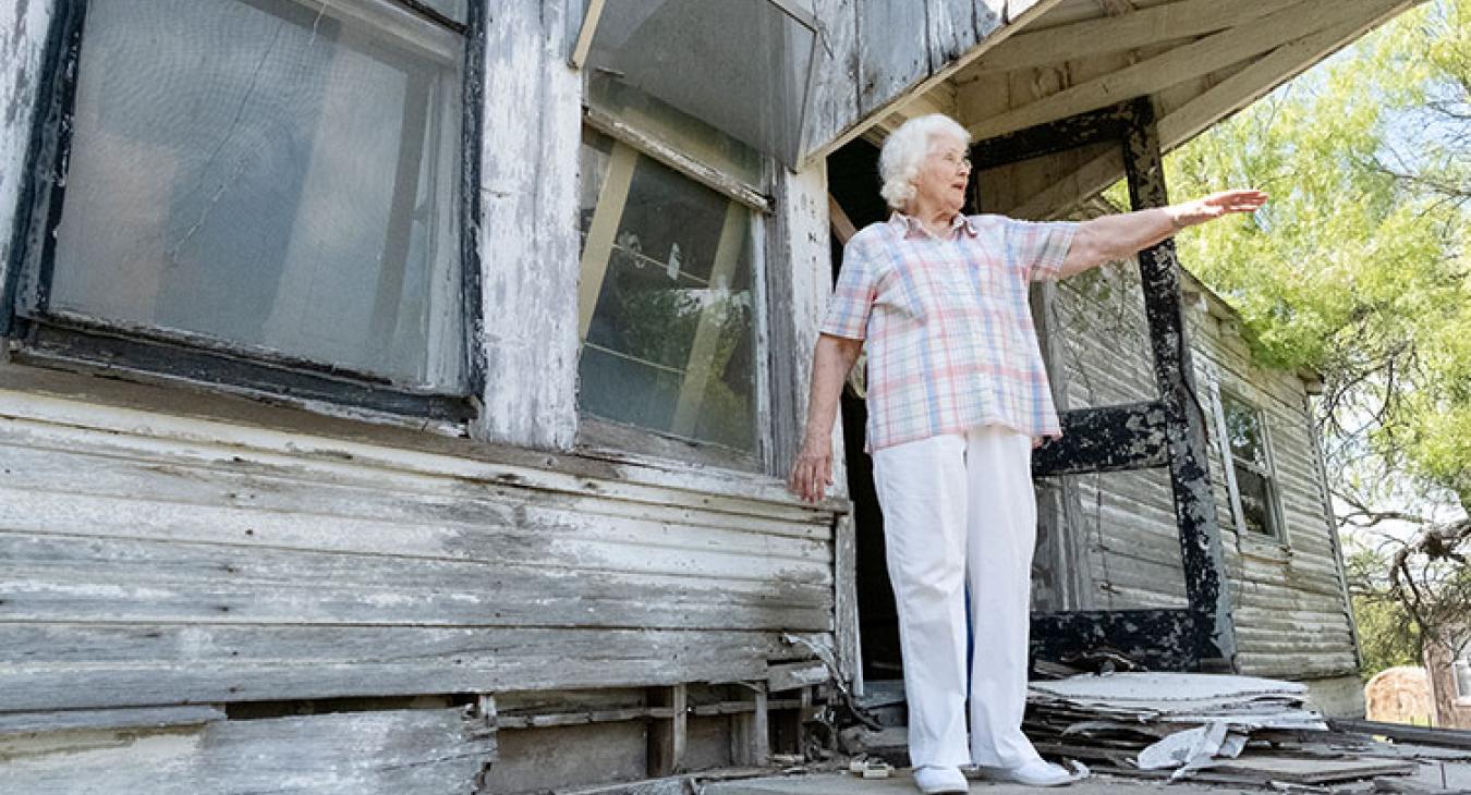 From the back porch, Jo Nell Schulze shares fond memories of growing up at the house she moved into at age 8. (Ralph Barrera photo)