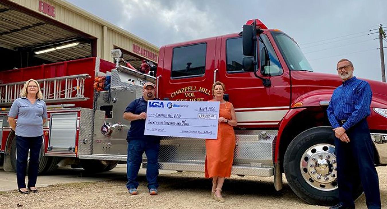 Pictured, from left to right, are Lori A. Berger, LCRA board member, Mat Kolajajak, Chappell Hill VFD assistant chief, Mary Kmiec, Chappell Hill VFD vice president, and Robert Mikeska, Bluebonnet Board secretary/treasurer. (Sarah Beal photo)