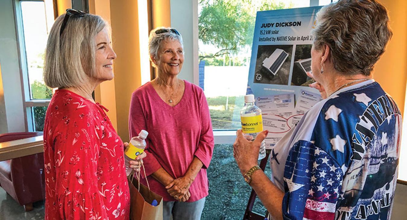 Bluebonnet member Judy Dickson, center, talks with Margaret Weller, left, and Jennifer Stephenson about the benefits of adding a solar array. (Sarah Beal photo)