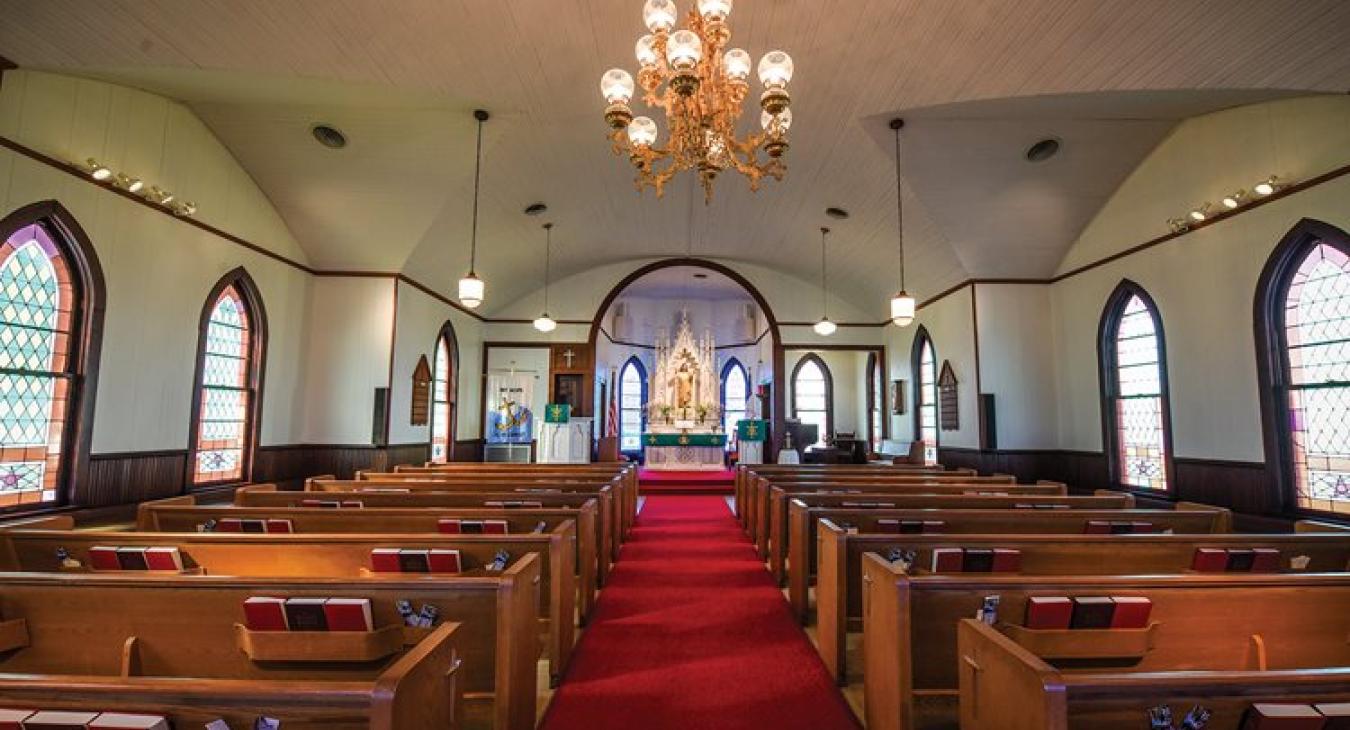 St. Matthew Lutheran Church exemplifies a traditional Texas-German Lutheran church, with features such as a carved wooden altar with a statue of Christ and narrow stained glass windows. Sarah Beal photos